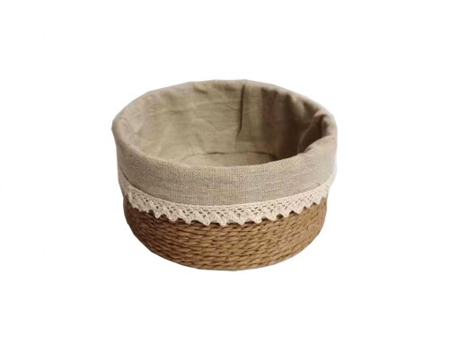 Basket of beige paper strips w/ beige fabric