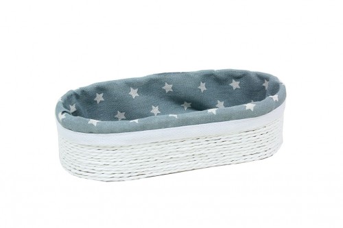 Oval basket with strips of white paper w/ fancy fabric