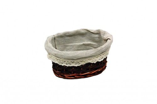 Oval brown wicker basket w/ white cloth