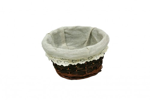 Oval brown wicker basket w/ white cloth