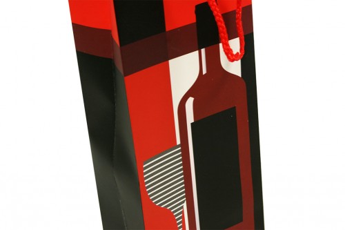 Cardboard bag bottle wine black background