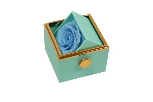 Boîte à bijoux rotative bleu rose stabilisée