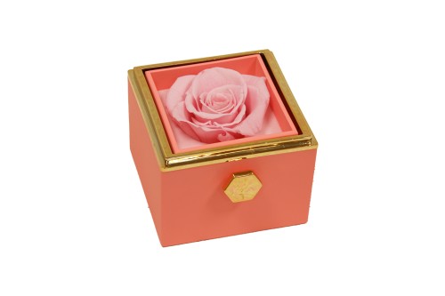 Boîte à bijoux rotative avec rose éternelle.