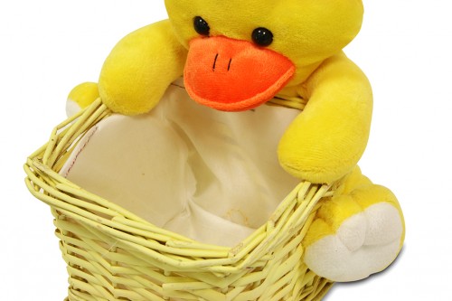 Yellow wicker tray with stuffed duck