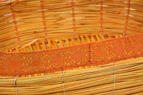 Light brown decorated metal wicker basket