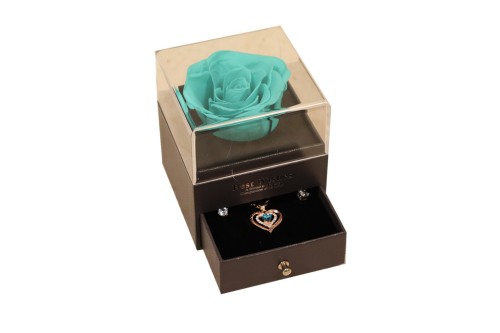 Rosa preservada azul clarito con joyas
